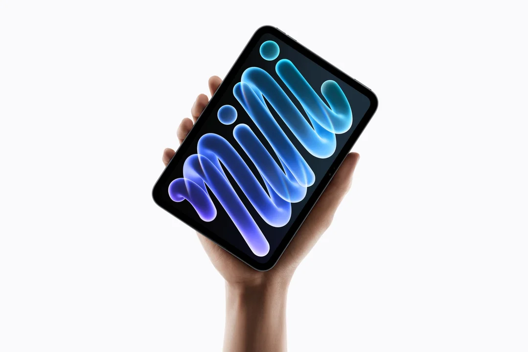 The new Apple iPad mini held in the palm of a hand