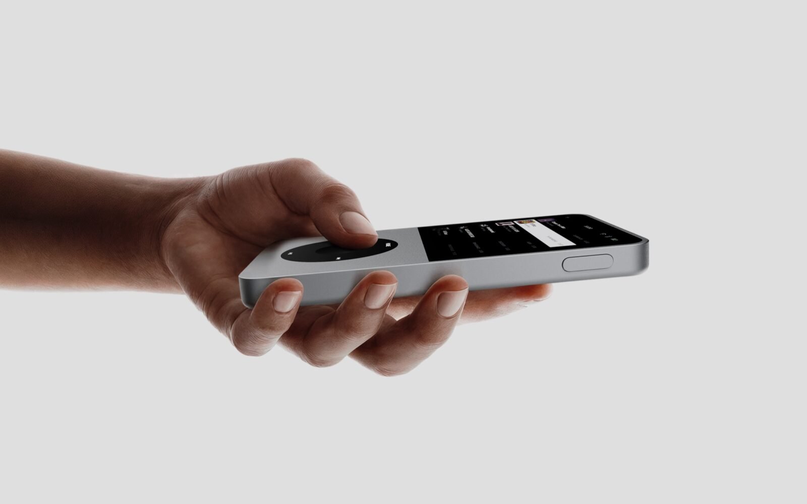 Sudo music player held in hand featuring tactile control wheel and square touchscreen