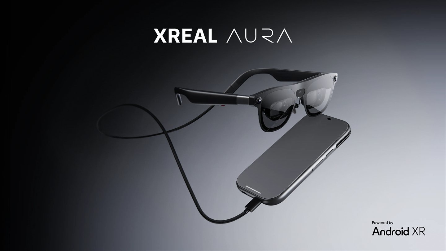 XREAL AURA optical see-through glasses with split-compute puck and trackpad